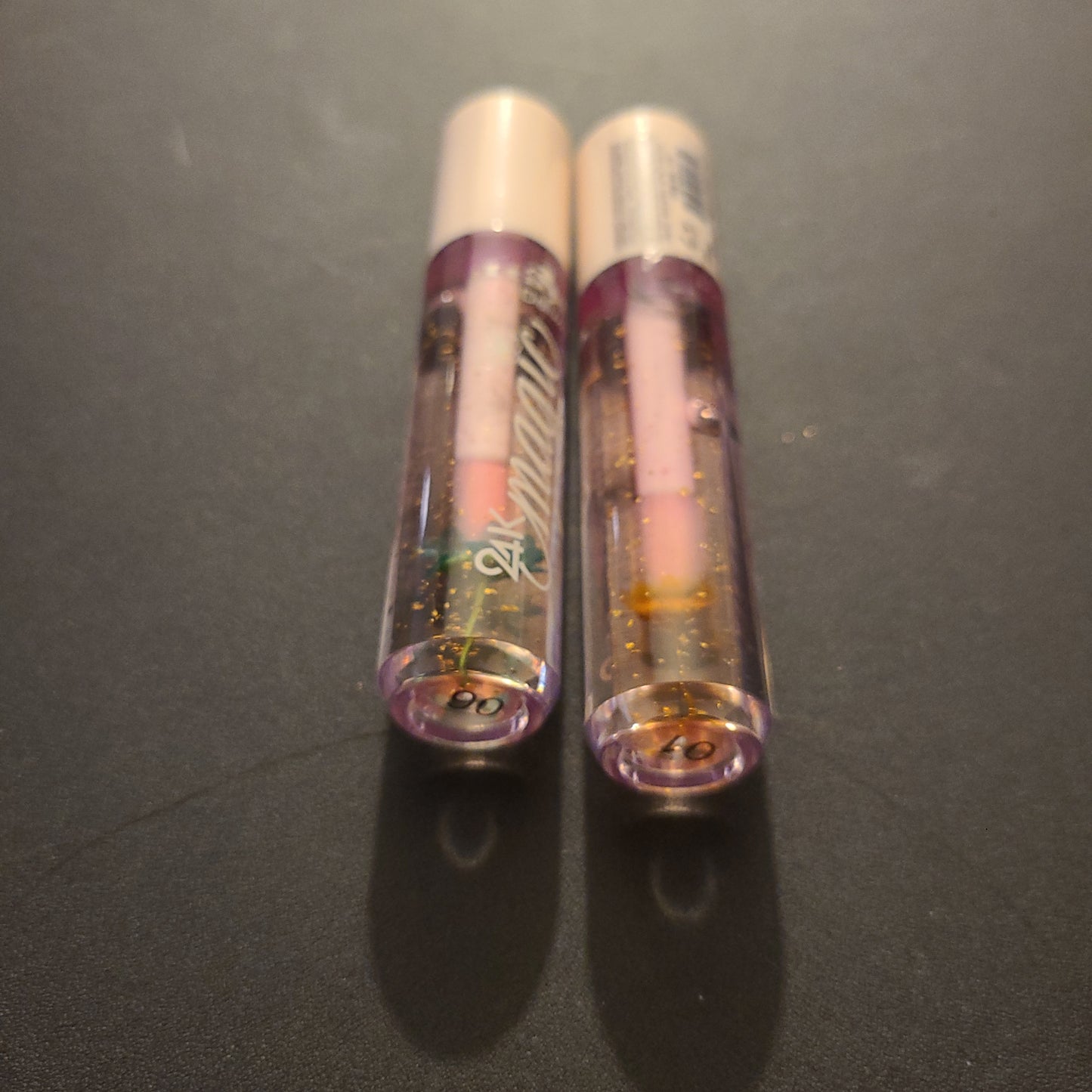 24k magic lip oils